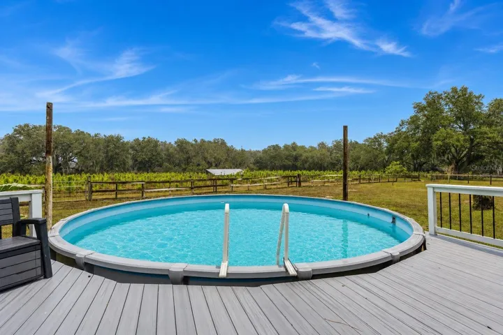 Outdoor living is enhanced by a well-maintained above-ground pool.