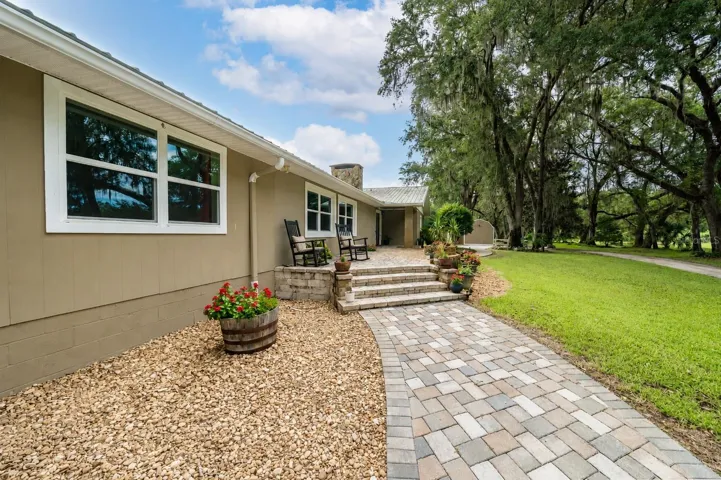 Stone-paved entry provides a timeless and attractive arrival.