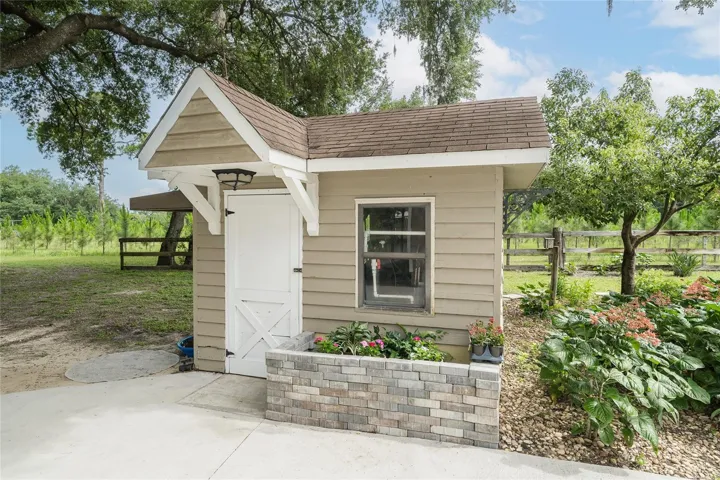 Well-maintained shed serves as home to the property's water filtration system.
