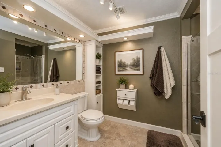 Guest bath, walk in shower with glass enclosure.