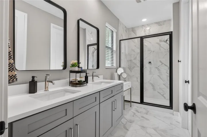 Primary Bathroom with Dual Sink and Walk-in Shower with glass enclosure