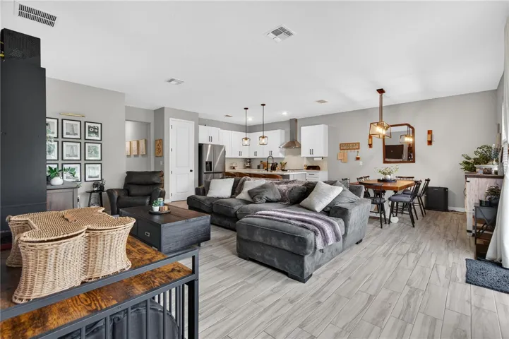 Entire view of the Living Area, Kitchen, and Dining Area