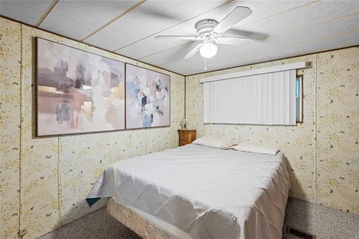 Primary bedroom is located in back of this home.