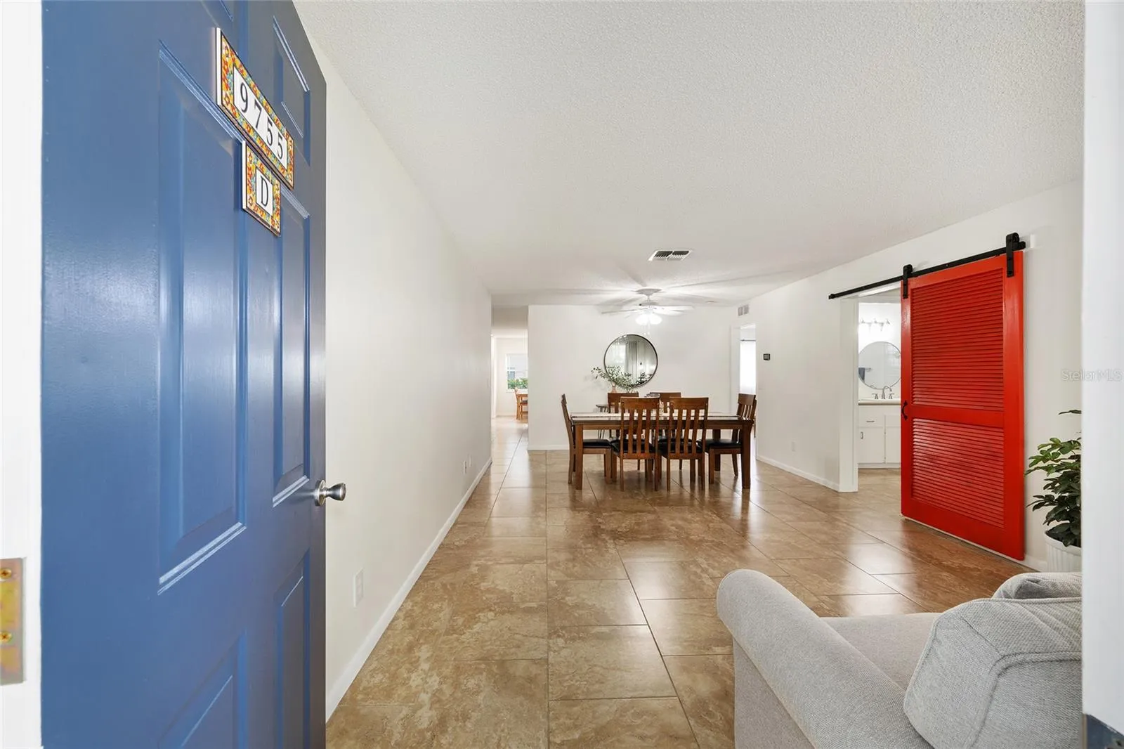 Upon entry, you are welcomed into a spacious living room/dining room combination with an open, inviting layout.