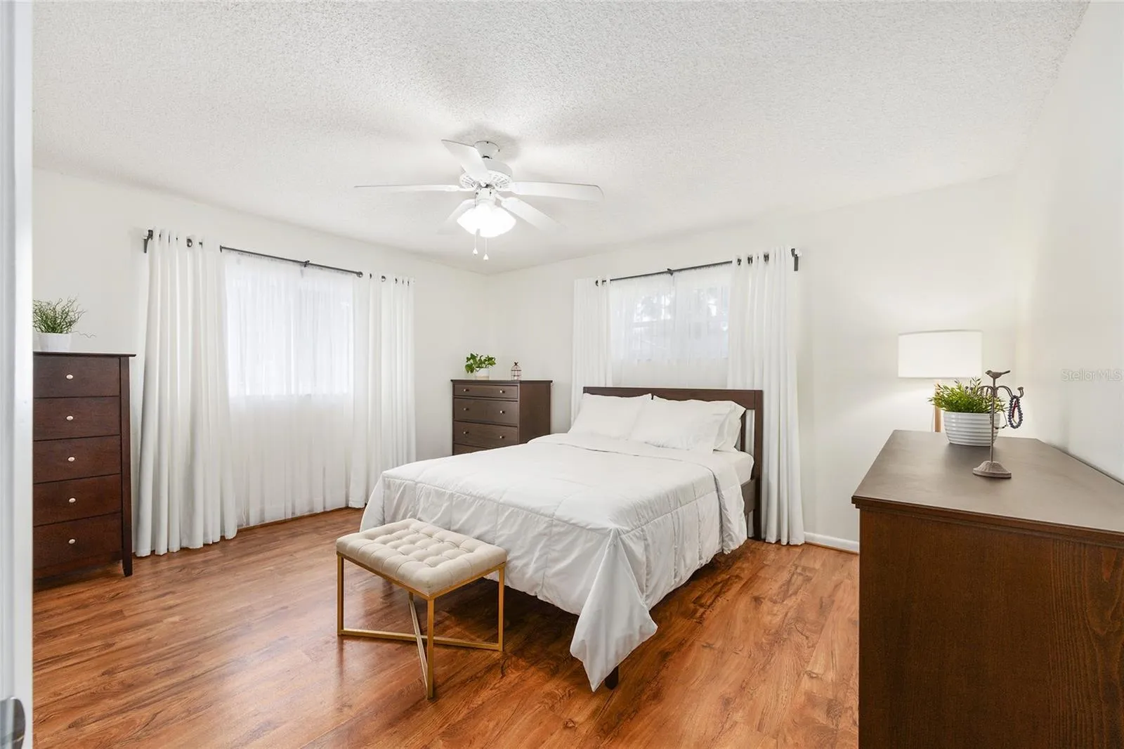 Primary bedroom offers a comfortable retreat with plenty of natural light.