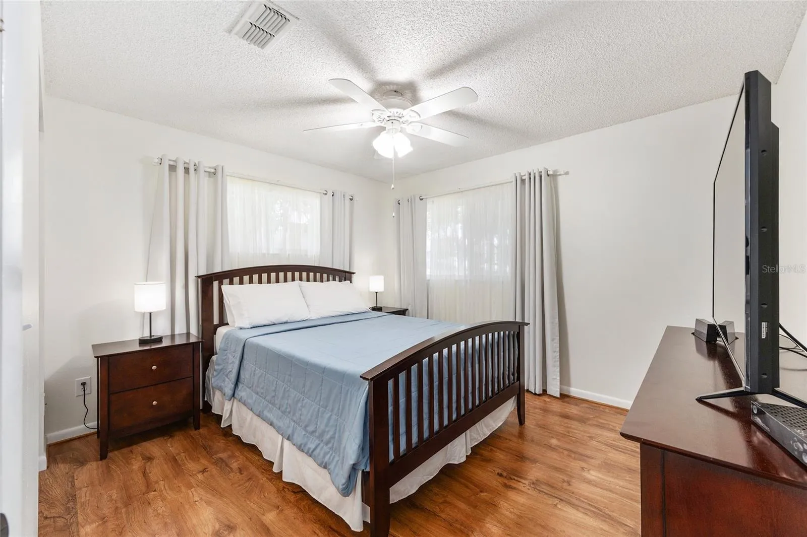 Guest ensuite with sliding barn door creates a true guest suite feel, ideal for long-term guests, multi-generational living, or anyone needing a private suite-style layout.