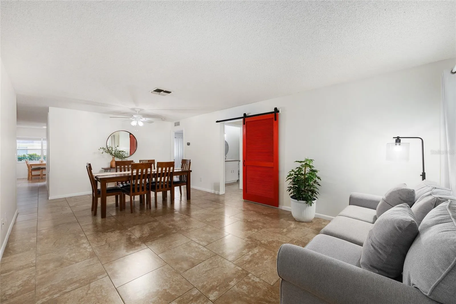 Upon entry, you are welcomed into a spacious living room/dining room combination with an open, inviting layout.