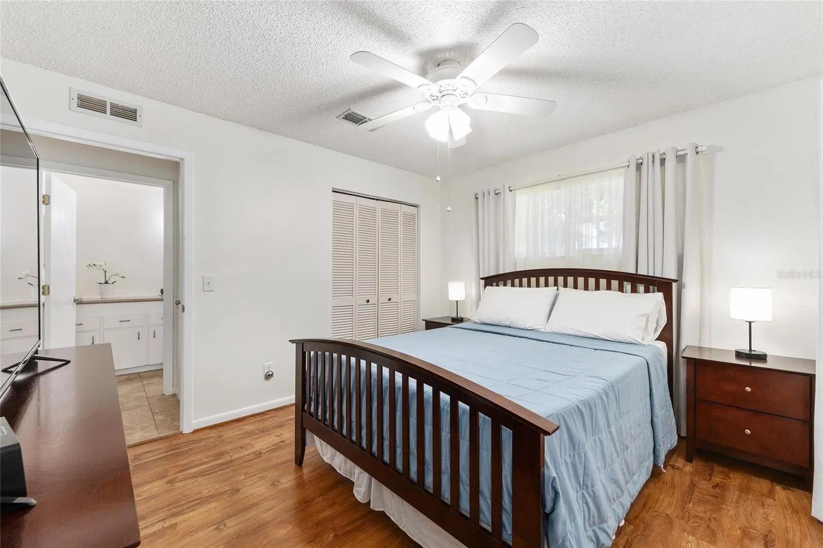 Guest ensuite with sliding barn door creates a true guest suite feel, ideal for long-term guests, multi-generational living, or anyone needing a private suite-style layout.