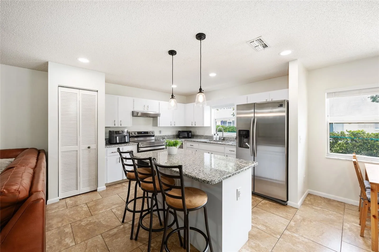 Updated kitchen featuring granite countertops, stainless steel appliances, and a clean, modern feel.