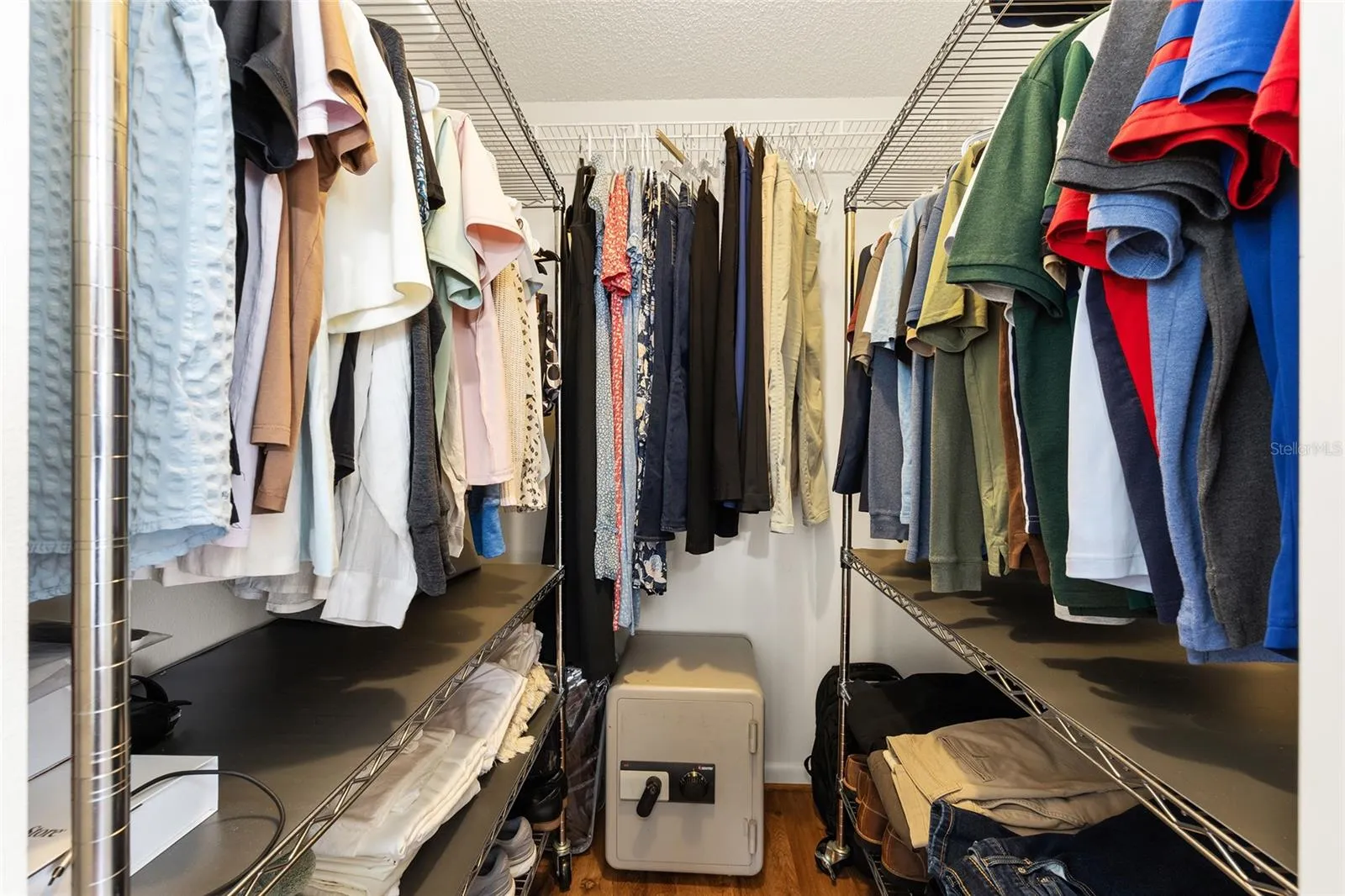 Spacious walk-in closet provides convenient storage and organization.
