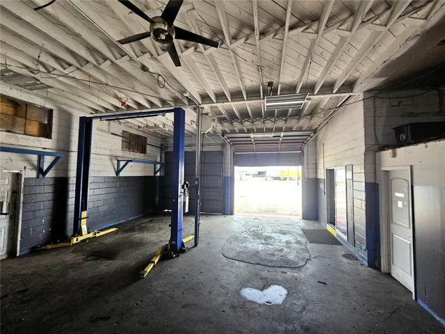 Main bays with dual 10'x10' overhead doors. Automotive lift not included