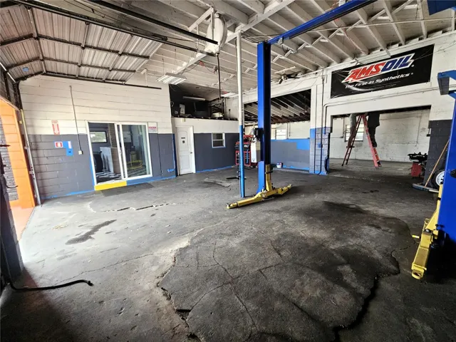 Main bays with dual 10'x10' overhead doors. Automotive lift not included