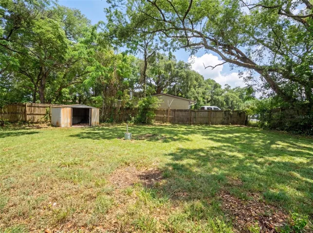 Spacious backyard with shed