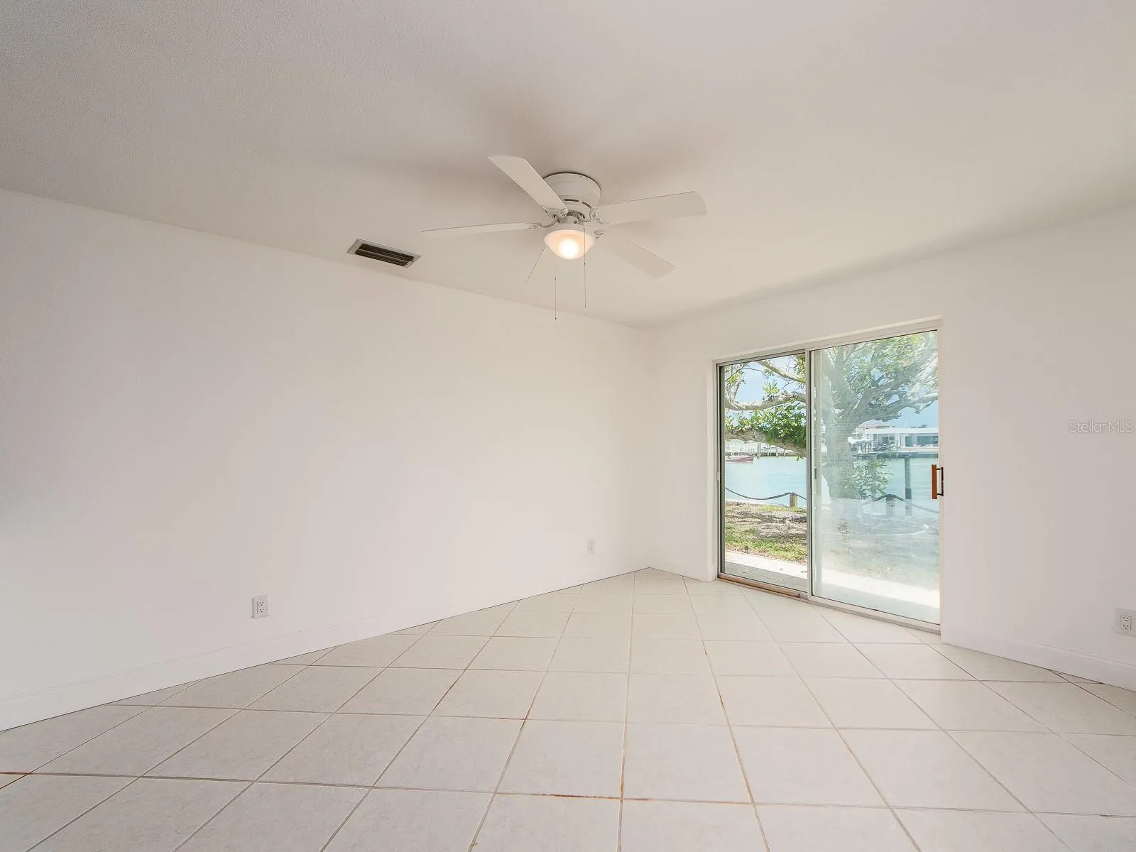 dining area leading to sliding patio doors