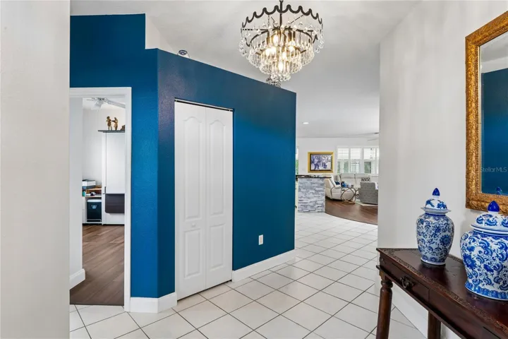 HALLWAY TO LIVING AREA WITH STYLISH CHANDELIER