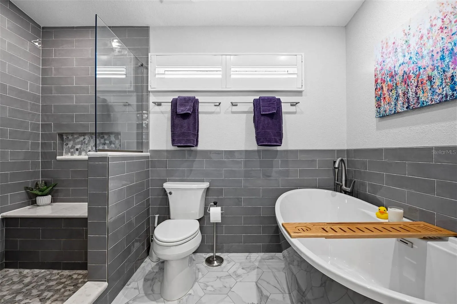 Relaxing soaker tub in Primary Bathroom with hot water provided by the On Demand Water Heater that supports 8.5 GPM so you can be soaking in minutes!