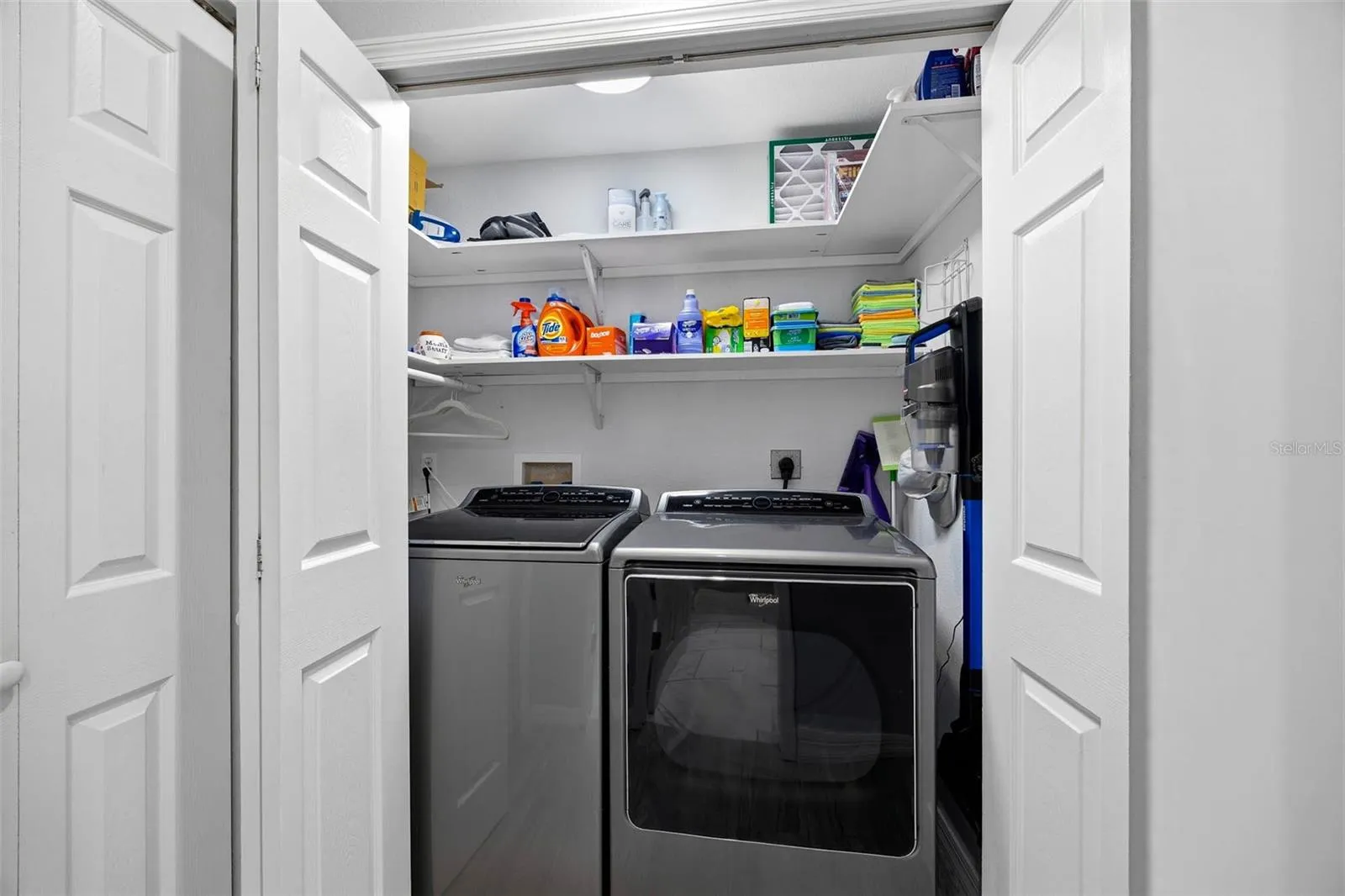 Laundry Closet with full size washer and dryer on main living level.