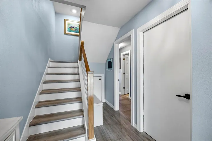 Interior entrance to unit showing door to garage and door to ground level entertainment room.