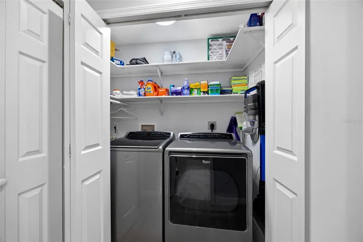 Laundry Closet with full size washer and dryer on main living level.