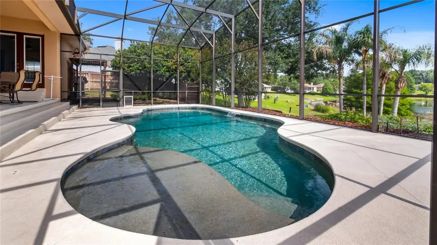 Patio to pool with beach on Lake Katherine