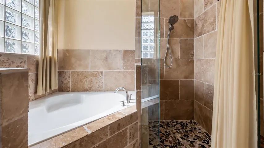 Primary suite, double sinks, soaking tub, walk in shower and water closet