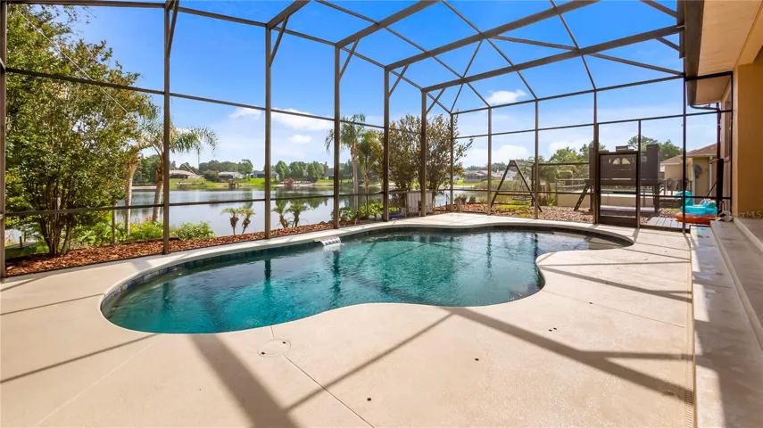Patio to pool with beach on Lake Katherine