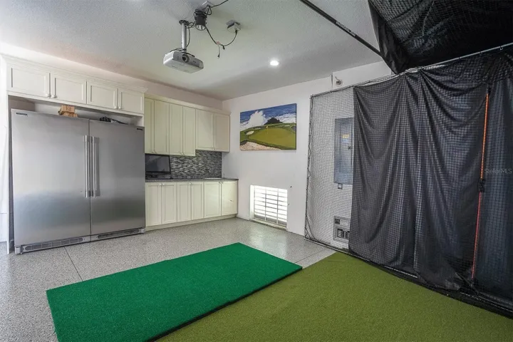 Garage w/ golf simulator