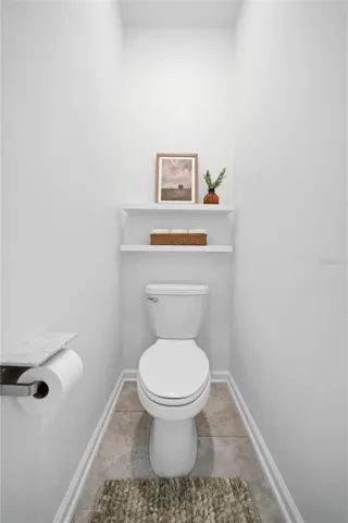 Secluded toilet for primary bathroom