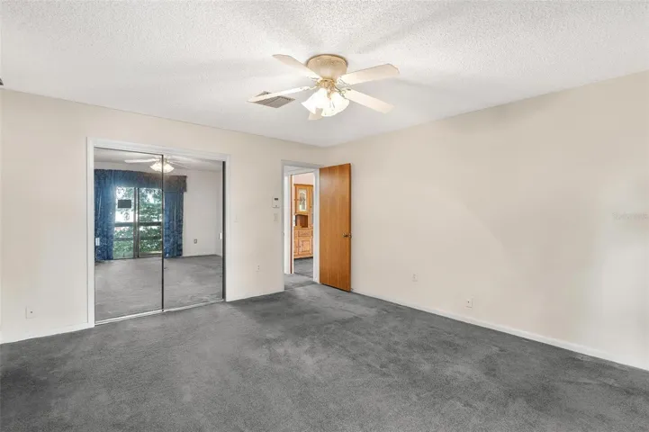 Primary Bedroom with sliders leading to balcony