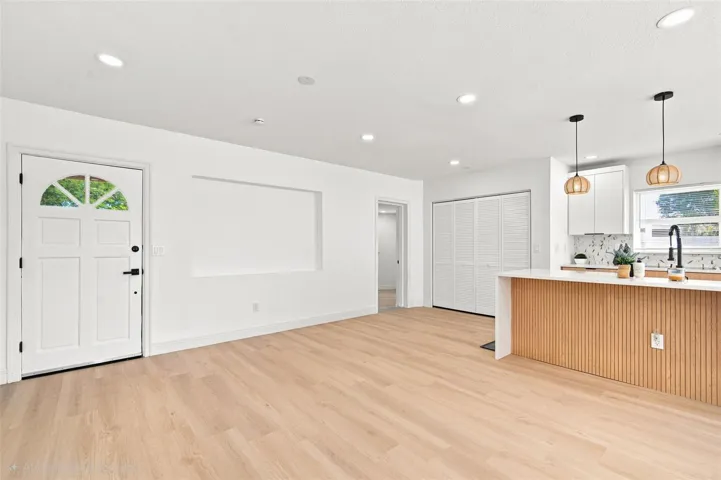 AI used to remove objects. Master Suite 1entry is the door on the far right.