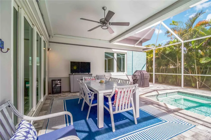 Screened lanai covered dining area