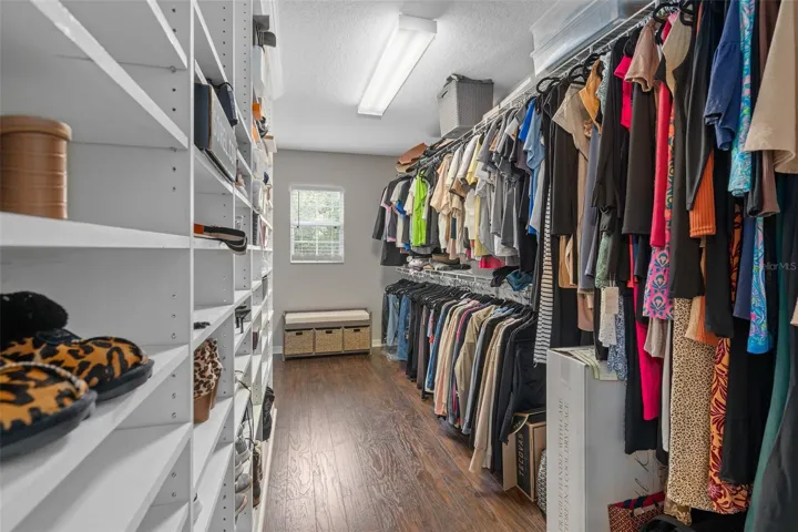 large custom built out master closet
