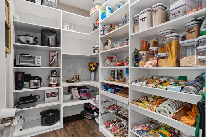 Large built out Pantry with electricity and custom backsplash for a perfect coffee station.