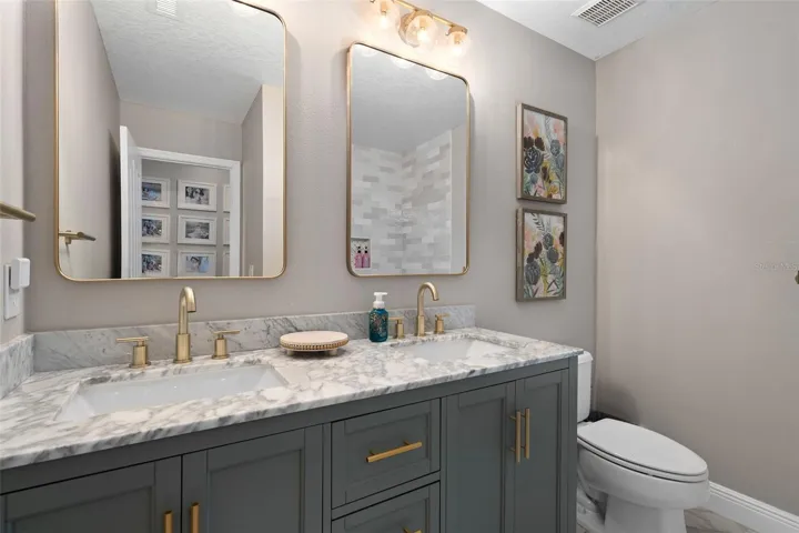 Bathroom 3 upstairs completely remodeled with stone countertops and a custom vanity