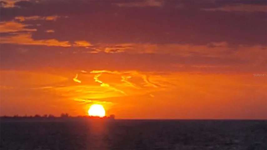 2026 SUNSET SETTING OVER AMI FROM RHW DOCK