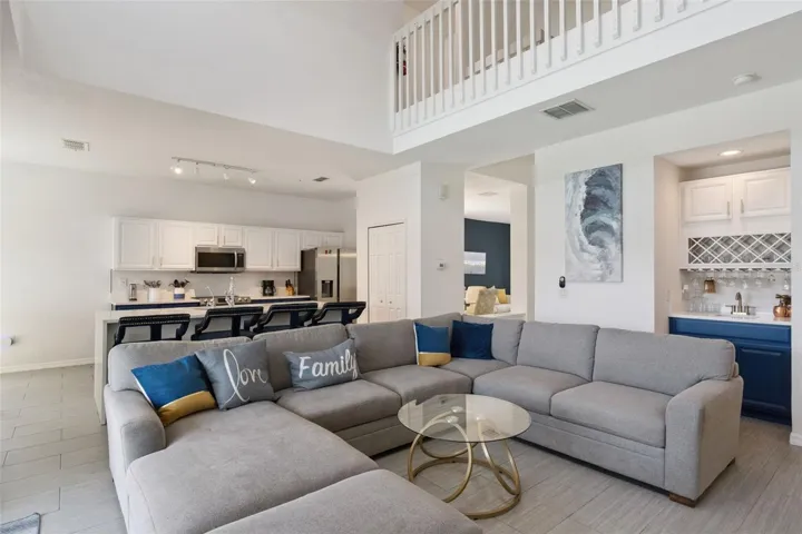 Open-concept layout connects the family room, kitchen, and wet bar