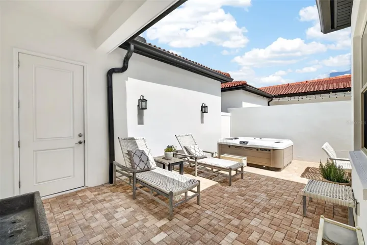 Covered paver walkway to garage