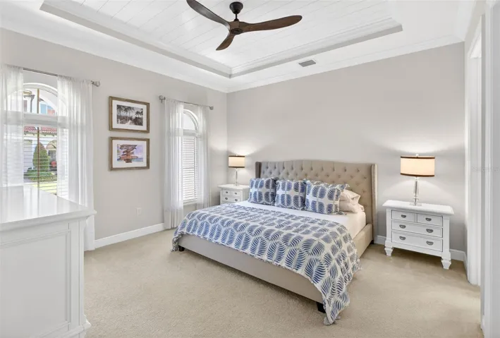 DOWNSTAIRS Primary suite with shiplap tray ceiling and Restoration Hardware fan