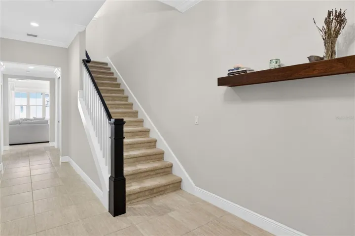 Carpeted stairway to loft