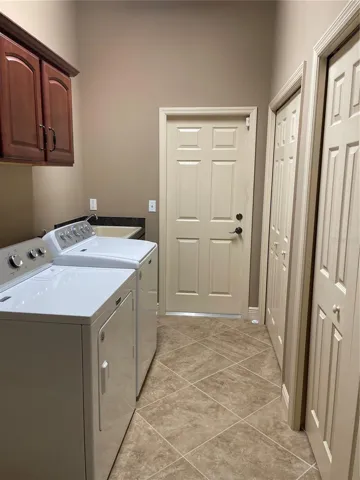 LAUNDRY ROOM WITH TONS OF STORAGE