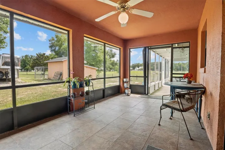 Screened in back patio, leads to the additional large covered back patio.