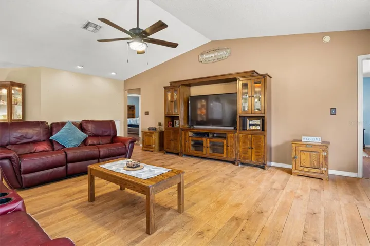 living room, door on the right is primary bedroom. Hallway to the left leads to two bedrooms and bathroom