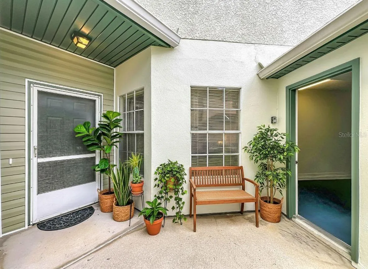 Courtyard view with garage door opened.