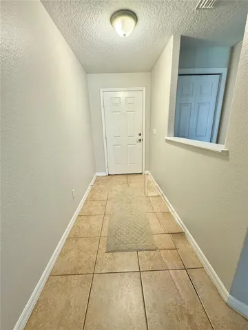 Welcoming foyer with pristine tile flooring