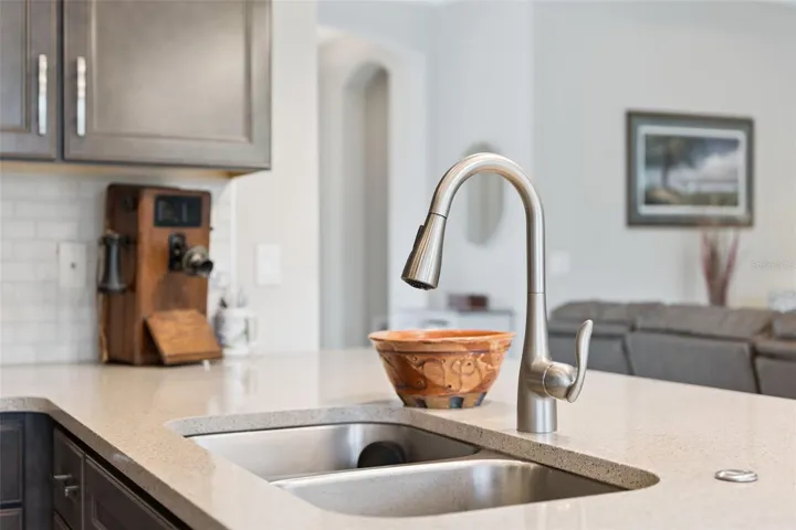 Kitchen w/ Quartz countertop, stainless steel sink & faucet w/ pull-out sprayer