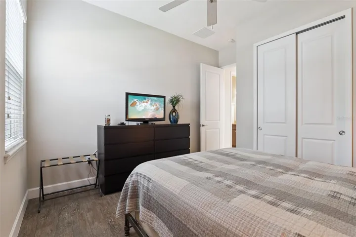 Bedroom #2 w/ porcelain plank tile flooring