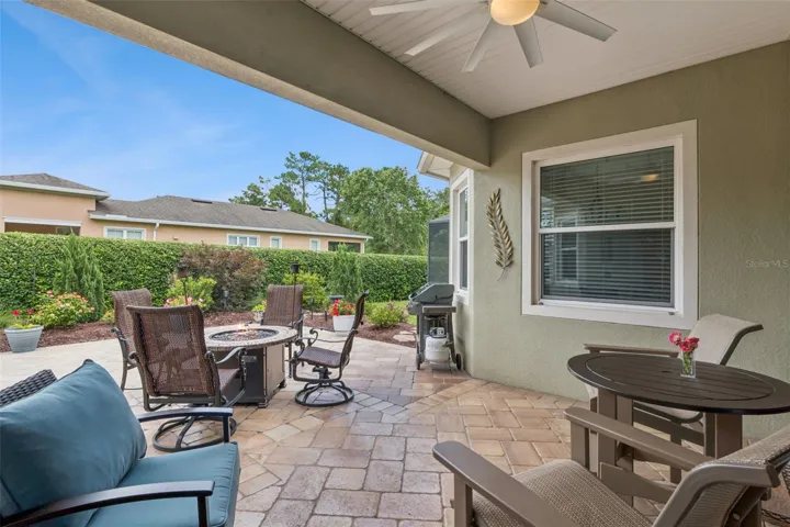Mature landscaped backyard w/ privacy hedge & conservation area view to right