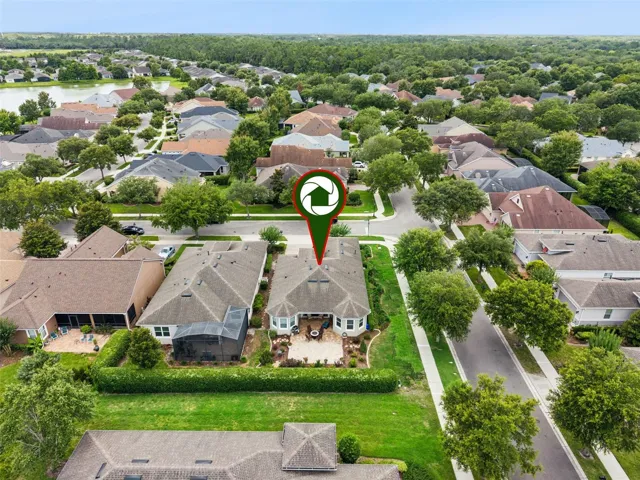 Aerial view of home's location on corner w/ privacy hedge