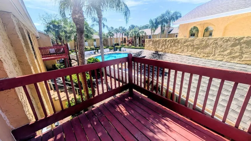 Deck with view of pool