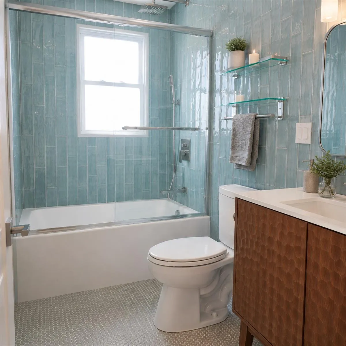 Common Bath off the hallway and designer tile from floor to ceiling